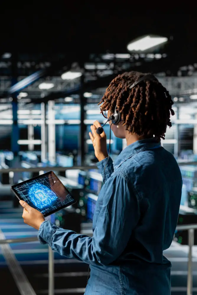 Engineer using tablet with AI brain interface in data center