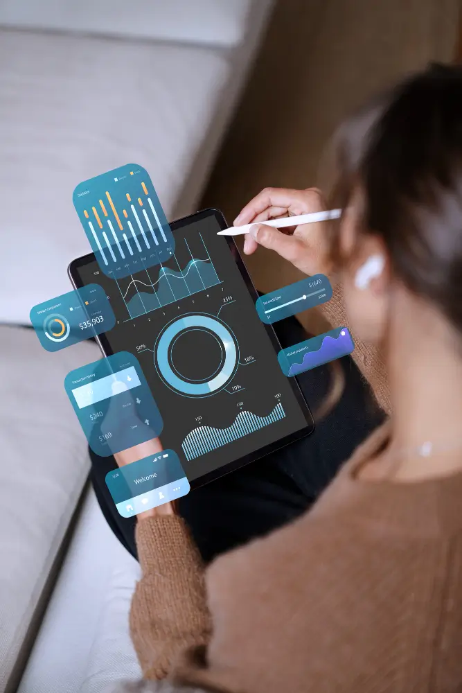 Person analyzing digital charts on tablet with stylus